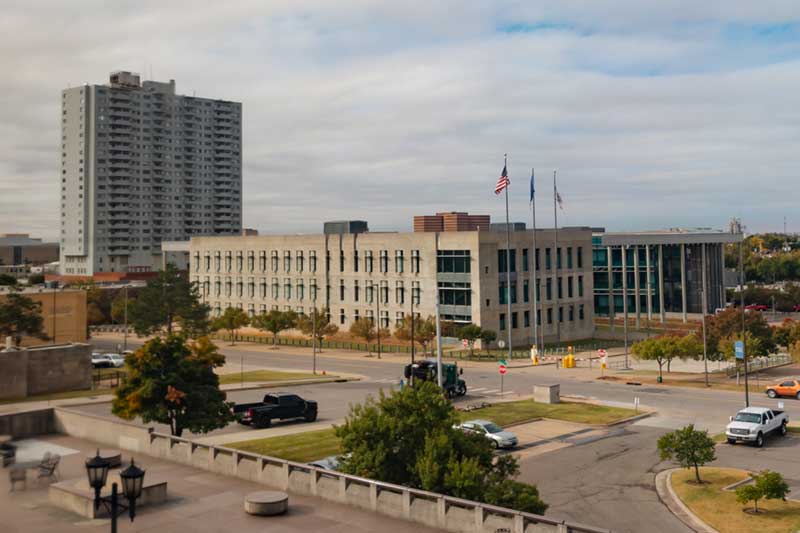 photo of OCU Law building with OKC in the background
